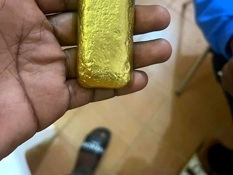 Refined poured gold doré bar with stamped identification at Bondo site