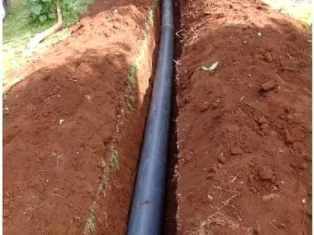 Pipeline trenching, bedding, and water reticulation pipe laying.